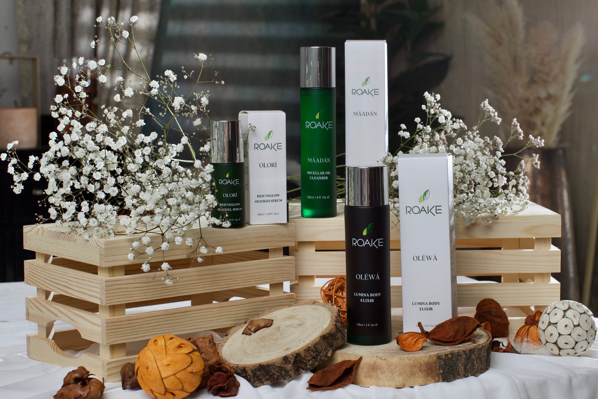 Roake skincare products on a wooden crate with decorative elements