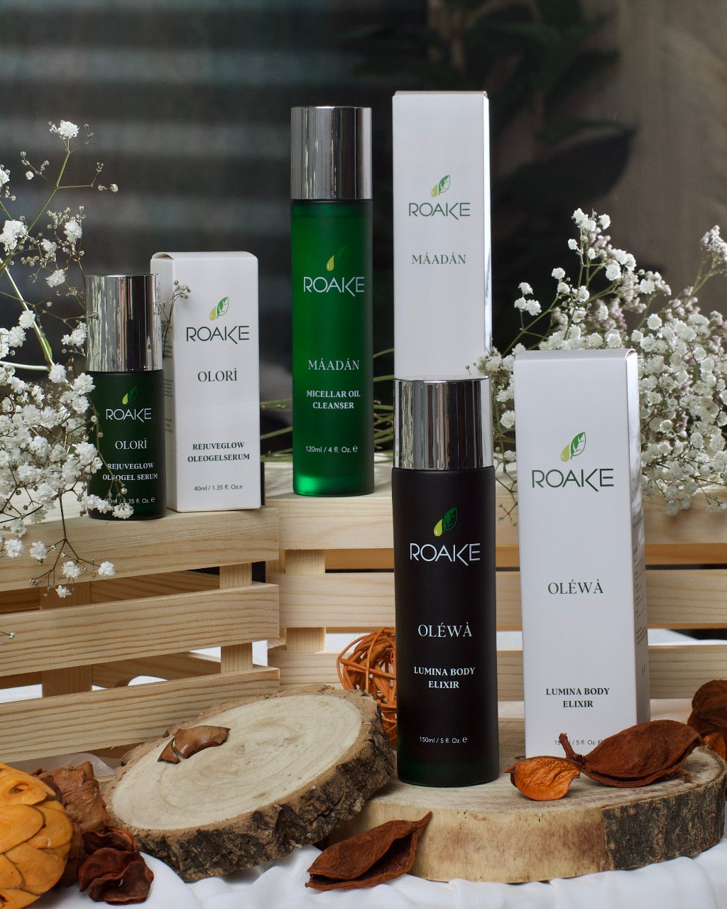 Roake skincare products on a wooden crate with decorative elements